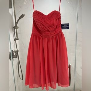Strapless coral bridesmaid dress